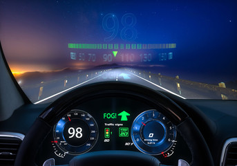 view from the cockpit of a car equipped with HUD and active safety systems.Systems detected fog on...