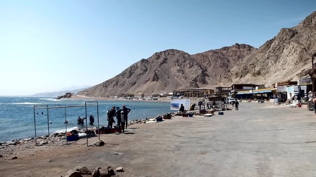 Colourful Tropical Coral Reefs. Picture of beautiful underwater colourful fishes and corals in the tropical reef of the Red Sea Dahab Egypt. Divers getting ready in Dahab Blue hole