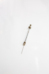 needle and thread on white background