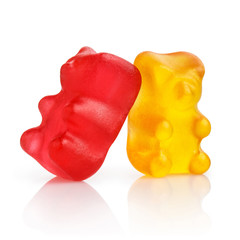 Two colorful jelly gummy bears, isolated on white background