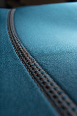 Close up of a blue neoprene scuba diving / surfing wetsuit