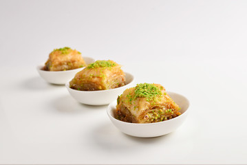 Pistachio baklava on a white background. Dessert.