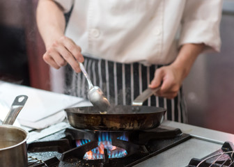 Chef cooking food in the kitchen, Chef preparing food