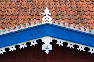 The hook - handmade decoration on fisherman's house. White, oran