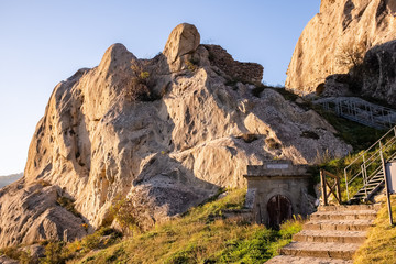 Ruins of Castelmezzano castle and gate of water reservoir. Dolomites of Basilicata mountains called Dolomiti Lucane. Basilicata region, Italy