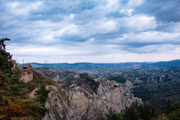 Badlands called calanchi. Landscape of Basilicata region at the sunset. Aliano, Matera province, Italy