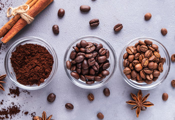 Different types of coffee beans in a bowl. Top view