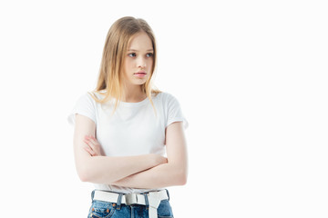 upset and offended teenage girl with crossed arms isolated on white