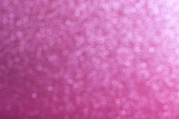 Bright pink abstract background with bokeh defocused lights
