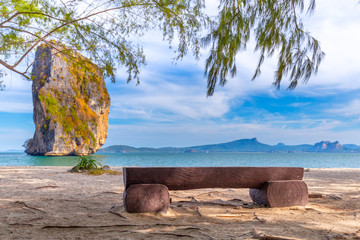 Beach chairs and palms on the beautiful beach for holidays and relaxation at Poda island, Thailand
