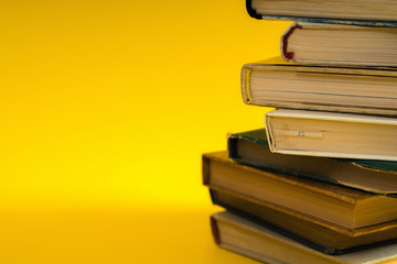 Open book, hardback hard cover colorful books stacked on the tab