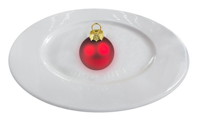 Boule de Noël dans assiette blanche 