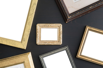 Blank empty frames on dark wooden background. Art gallery, museu