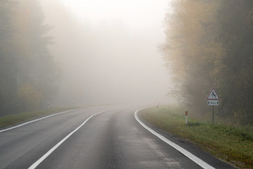 Driving on countryside road in fog. Illustration of dangers of d