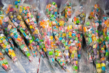 Fototapeta premium Many assorted sweet sugar candies on display in the candy store