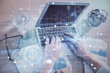 Businessman with computer background with technology theme hologram. Concept of big data. Double exposure.