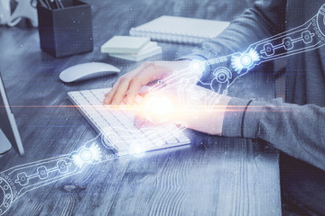 Fototapeta premium A man working on computer with technology theme drawing. Concept of big data. Multi exposure.