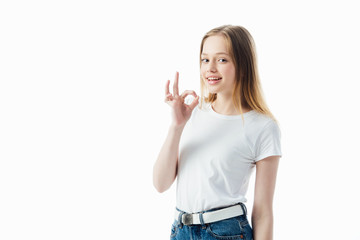 happy teenage girl showing ok sign isolated on white