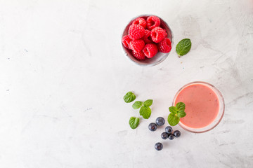 Red smoothie with raspberries and basil