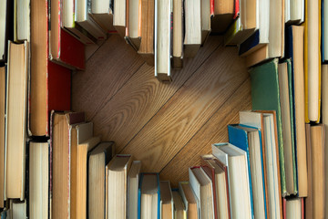 Love concept of heart shape from old vintage books on wooden flo