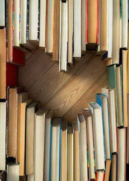 Love concept of heart shape from old vintage books on wooden flo