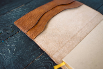 leather handmade notebook (organizer) on dark wooden background