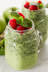 Tasty green smoothie with strawberries
