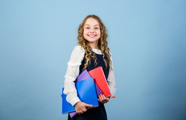 knowledge and education. Back to school. notebook for diary notes. study lesson. small girl with paper folder. hometwork. happy small girl wants to be teacher. Confident student studying