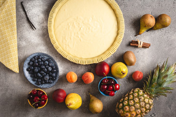 Fresh Dough Fruit Tart Pie Preparation. Ingredients for Baking Cake. Healthy Eating Concept.