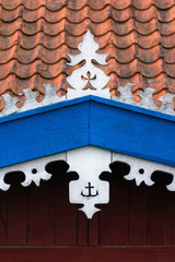 The hook - handmade decoration on fisherman's house. White, oran