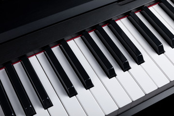 Naklejka premium Grand piano keyboard with glossy black and white keys as a music, Select focus and soft focus.