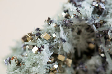 Pyrite on white background, also known as iron pyrite and fools gold
