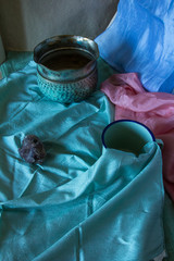 Pastel colored still life photograph with archaic objects