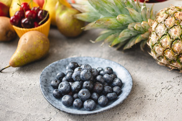 Blueberries and Fresh Fruits. Diet and Healthy Eating Concept.