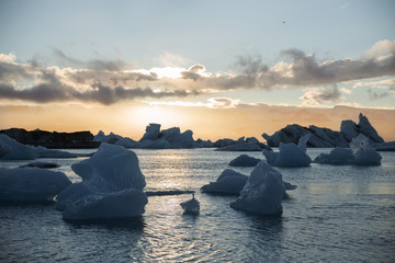 Icebergs floating in the water at sunset. Iceland, Jokulsarlon Glacier Lagoon © Denis Mustafin
