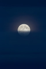 Full moon on dark blue sky