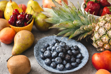 Blueberries and Fresh Fruits. Diet and Healthy Eating Concept.