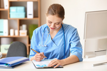 Young medical assistant working in clinic