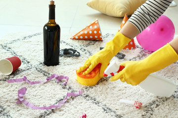 Janitor cleaning room after party