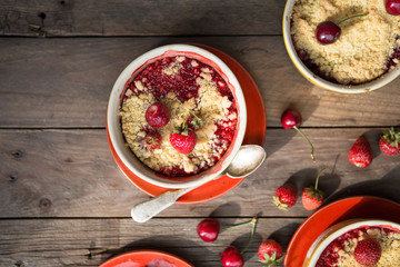 sweet pie. crumble with strawberries and red merry. Summer strawberry tart with crumble, top view