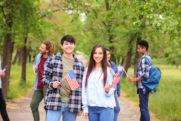 Group of students with USA flags outdoors