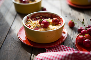 sweet pie. crumble with strawberries and red merry. Summer strawberry tart with crumble, top view