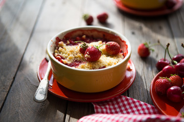 sweet pie. crumble with strawberries and red merry. Summer strawberry tart with crumble, top view