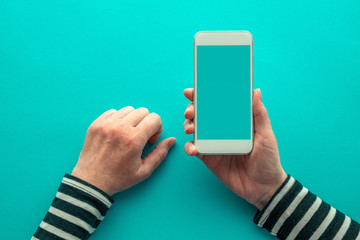 Top view of smartphone mock up on female hands