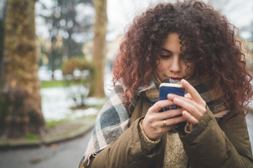 portrait of young woman using smartphone