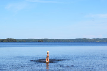 Handstand in a lake in Sweden