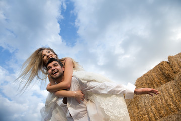Fototapeta na wymiar bride and groom on the background of the sky feeling of flight