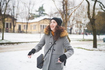 Obraz premium portrait of young woman standing in park in winter day