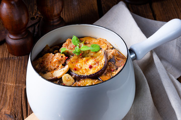 Veal goulash with baked aubergine and herbs