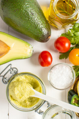 Vegan Raw and Healthy Fresh Food Concept. Organic Green Avocado Spread Guacamole in Jar.